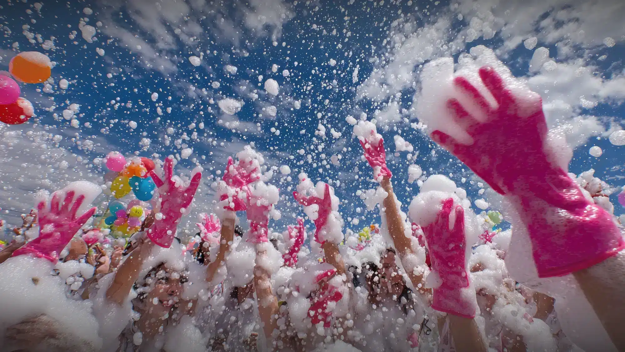 Children enjoying a foam party in Long Island with vibrant colors